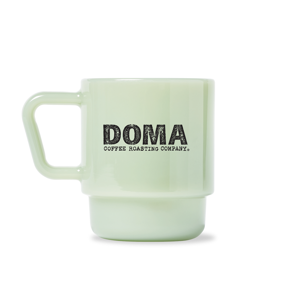 
                  
                    Milk Glass with DOMA Logo
                  
                